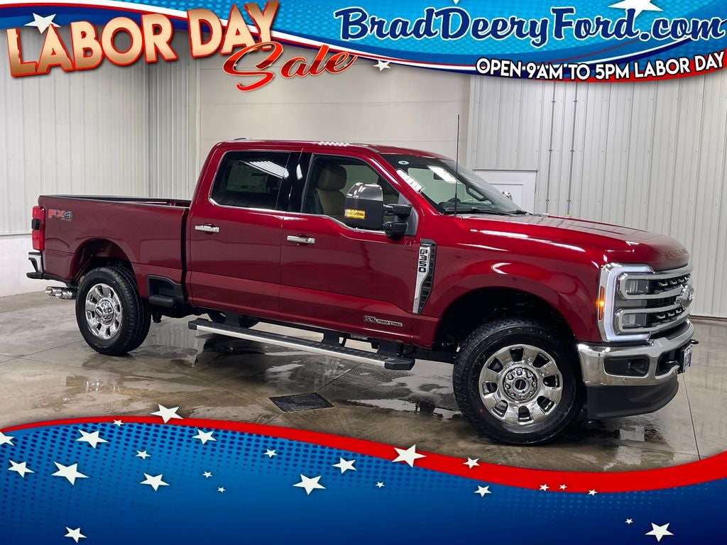 2026 Ford F-350SD Lariat in Ruby Red Metallic Tinted Clearcoat — front three-quarter view